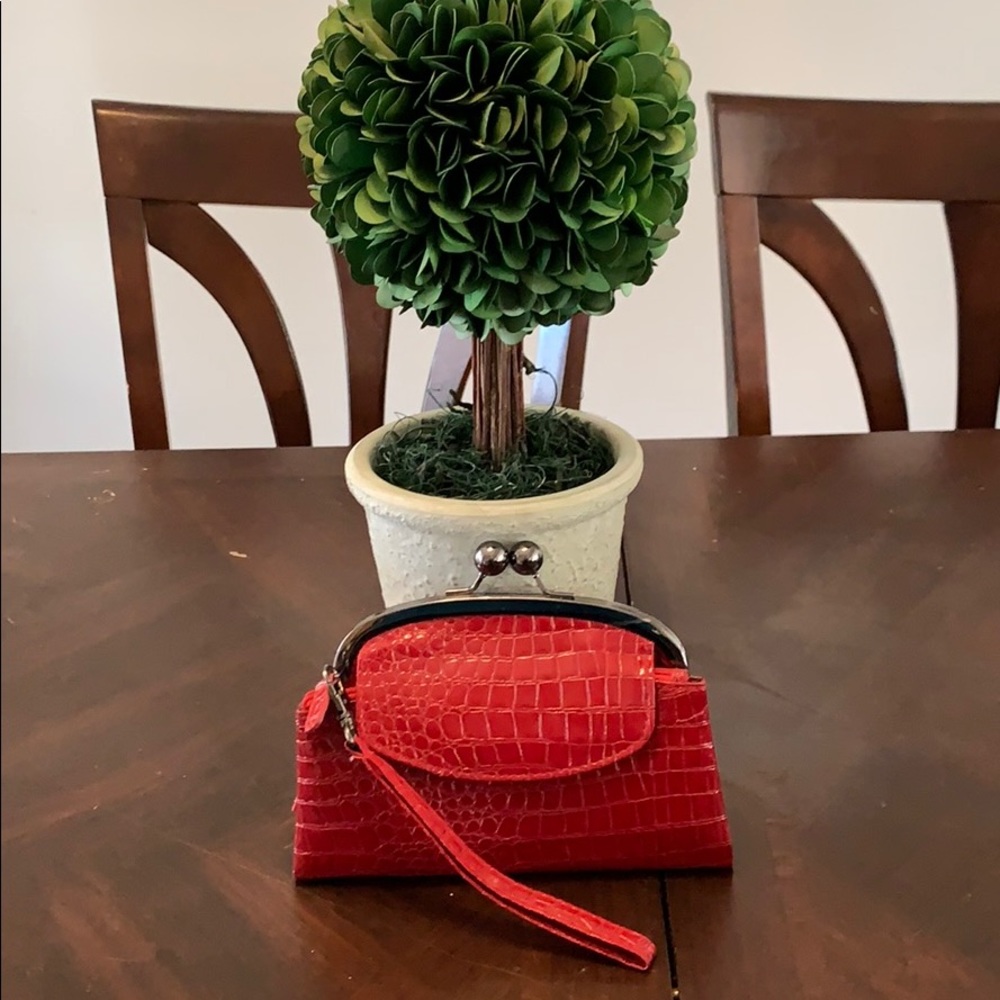 Red crocodile clutch.